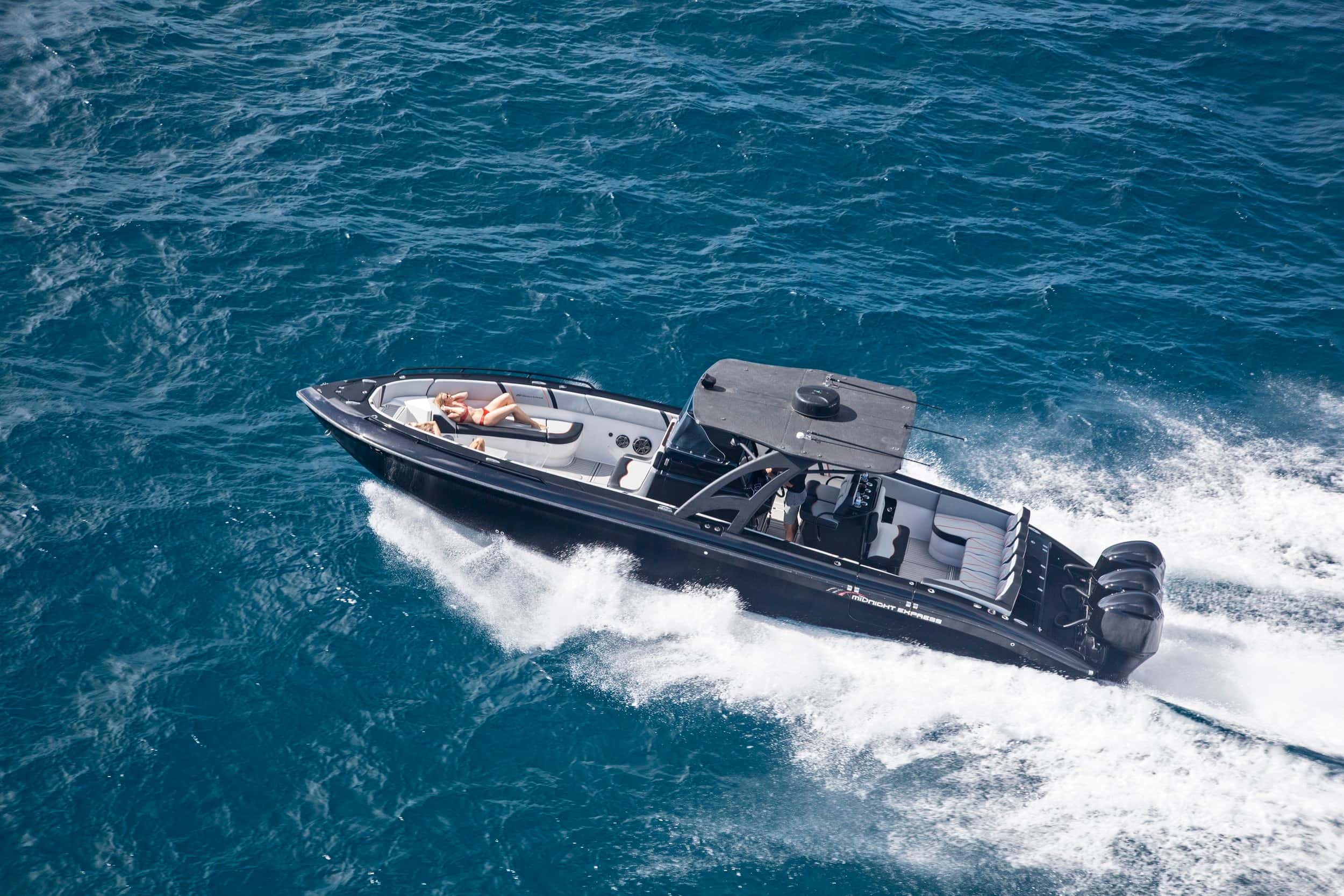 The 37ft luxury boat running across turquoise water off St. Thomas, seen from above